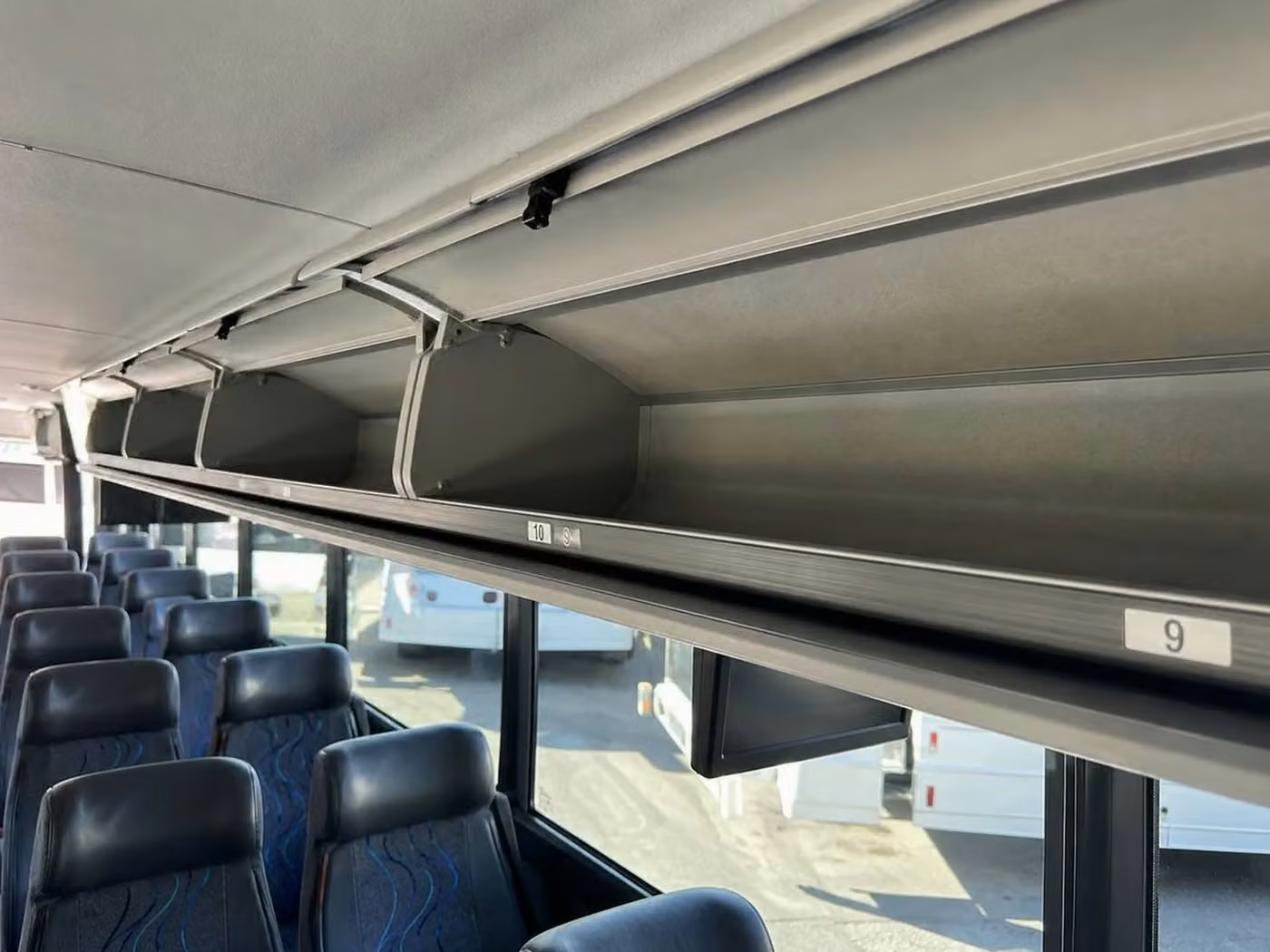 lima 56 passenger charter bus overhead storage